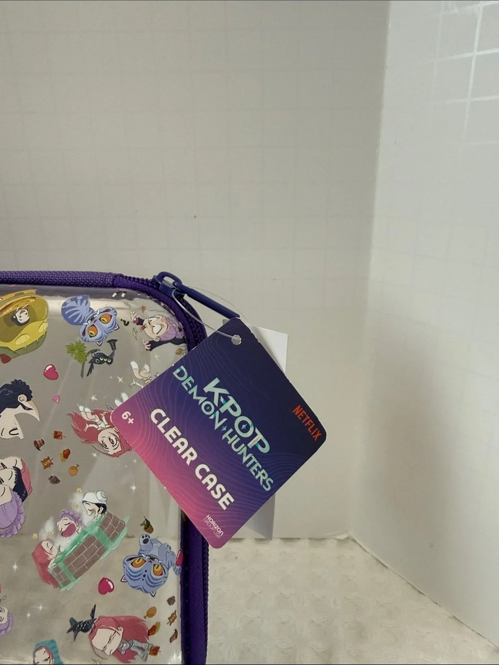 Netflix K-POP Demon Hunters Chibi-Style Clear PVC Pencil Case with Purple Trim.